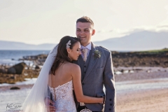 Couple on beach, wedding dress, ayrshire, waterside