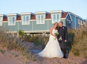 Bride and groom, wedding flowers, waterside