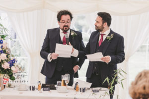 Brothers making speech at wedding
