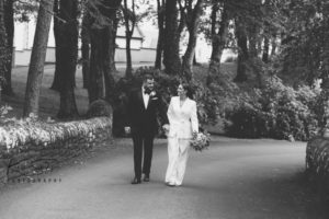 Bride and groom walking at Rowallan Castle