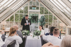 The glasshouse, groom saying a speech